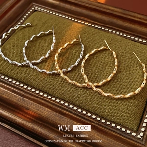 Elegant gold and silver plated wave-textured C-shape hoop earrings for a stylish look