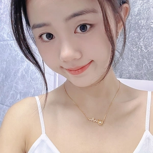 Elegant 18K gold-plated lightning heart necklace with cubic zirconia on female model