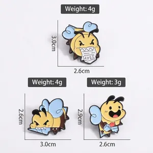 Three enamel bumblebee brooches in playful poses made of painted alloy for unisex wear