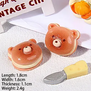 Macro detail of miniature resin bear cookie charms with precise 1.8cm size measurements