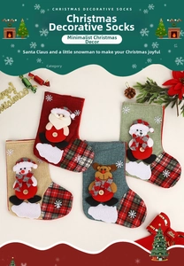 Detail of four Christmas stockings featuring 3D Santa, snowman, reindeer and bear embroidery