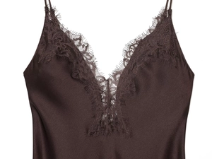 Detail of elegant chocolate brown satin dress showing eyelash lace and silk texture