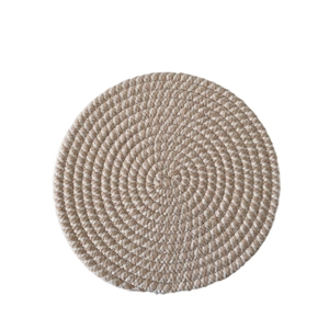 Detailed close-up of a brown and white woven cotton rope heat-resistant dining coaster