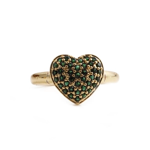 Macro shot of gold adjustable ring with emerald green heart micro-pave cubic zirconia