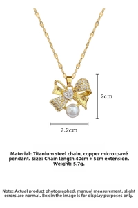 Detail of gold bow necklace with micro-pave crystals and pearl accent measurements