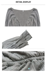Detail display of gray V-neck sequined pleated fabric dress with ruffle cuffs