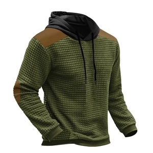 Detail of olive green waffle texture hoodie with brown shoulder and elbow patches