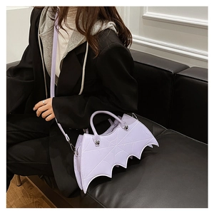 Detailed view of light purple bat wing crossbody bag with spider web stitching