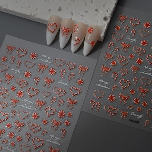 3D relief Christmas nail stickers featuring red candy canes and bows on white French tips