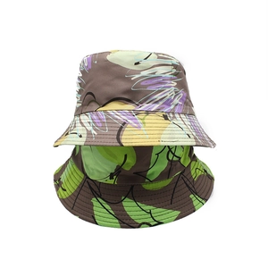 Two pack wide brim bucket hats featuring colorful abstract prints and tropical leaf patterns