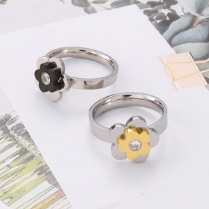 Minimalist titanium steel flower rings with black and gold petals and zircon center