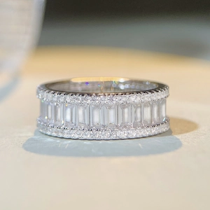 Macro shot of silver S925 ring featuring double row rectangle and round cut cubic zirconia