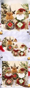 Close-up of burlap Christmas gift bags with reindeer and snowman plush designs