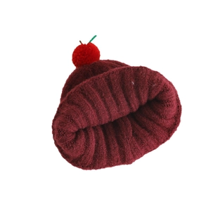 Cute apple-themed baby knit beanie with cherry pom-poms and ribbed winter texture