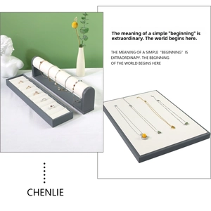 Three-piece jewelry display set with gray wood frame and beige velvet lining for counters