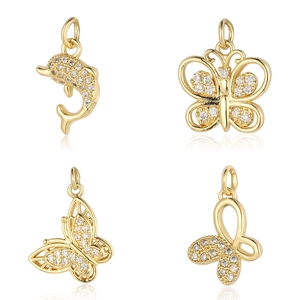 Golden dolphin and butterfly charms with sparkling cubic zirconia for jewelry making
