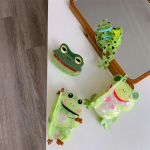 Detailansicht von Haarklammern aus Acetat in verschiedenen süßen Frosch-Designs