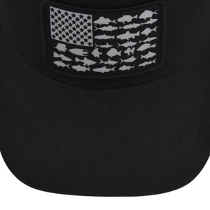 Macro detail of high-quality embroidery featuring fish patterns on black mesh cap