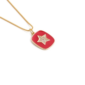 Gold box chain necklace with red enamel rectangular star pendant and micro-set zircons