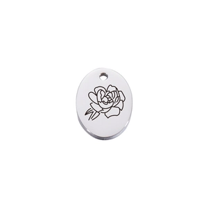 Detail view of oval silver stainless steel pendant with etched June rose flower pattern