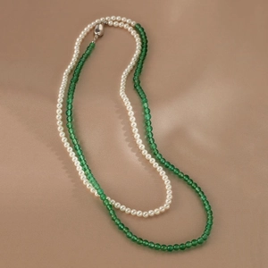 Elegant double-layered necklace featuring white pearls and green agate beads with metal clasp