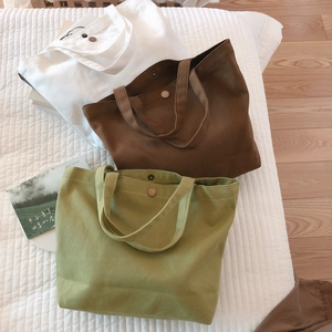 Minimalist canvas tote bags in white brown and green colors with magnetic snap closure