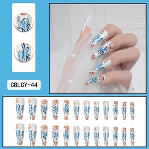 Long ballerina press on nails with blue cookie graffiti and brown biscuit art patterns