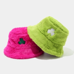 Winter plush bucket hats with clover embroidery in vibrant rose pink and bright green colors