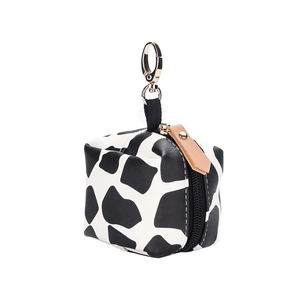 Waterproof faux leather pacifier bag with cow print pattern and golden keychain hook