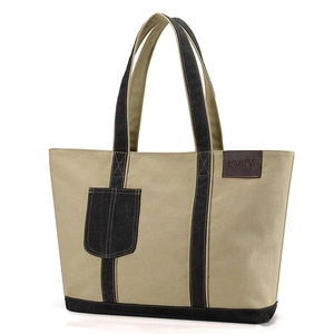 Große minimalistische Canvas-Tragetasche in Beige mit schwarzen Akzenten und Henkeln