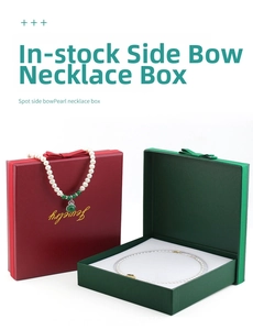 Detail of red and green jewelry boxes with elegant bows and sponge insert