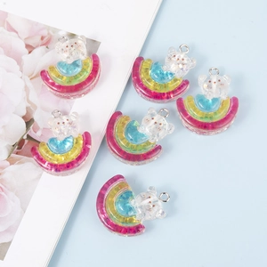 Set of 6 glitter resin rainbow bear charms for DIY jewelry making on light blue background