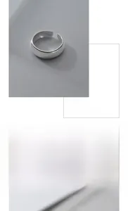 Close-up of polished S925 sterling silver open ring with smooth glossy finish