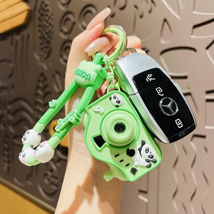 Cute panda camera keychain with green silicone strap and glowing projection feature for bags