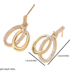 Detail view of gold hoop earrings with white zircon accents including size measurements