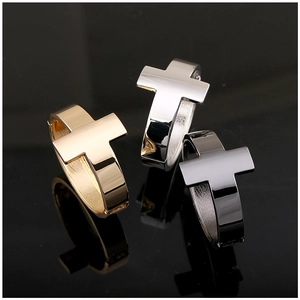 Modern minimalist cross cuff bracelets in gold, silver, and black polished metal finish