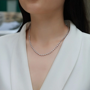 Classic S925 sterling silver tennis necklace with sparkling moissanite stones on model