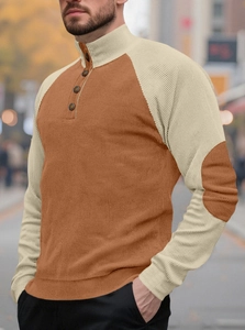 Detailed view of men's buttoned high collar with striped corduroy texture and color contrast
