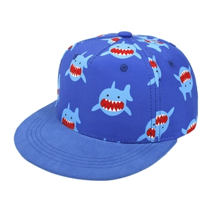 Kids navy flat brim baseball cap featuring cute all-over blue shark cartoon prints