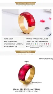 Detail view of gold stainless steel ring with large faceted red glass gemstone