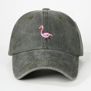 Detailed embroidery of a pink flamingo on a vintage washed dark grey baseball cap
