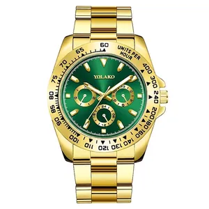 Macro shot of gold business watch featuring green sunray dial and luminous markers