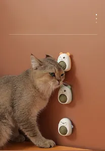 Close-up of three cute rotatable catnip balls in cartoon animal shapes for cats to lick