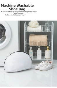 Vue détaillée du sac à linge en maille blanche pour chaussures avec fermeture éclair noire