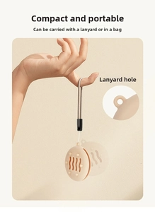 Close-up of beige silicone makeup puff holder with ventilation holes and lanyard