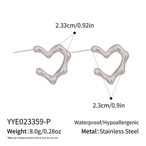 Detail view of irregular lava texture heart earrings in waterproof stainless steel