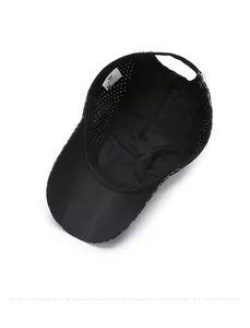 Detailed interior of black mesh cap showing laser-cut ventilation holes and adjustable strap