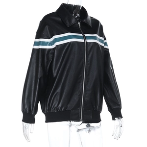 Detail of black distressed leather jacket featuring green and white striped chest contrast