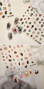 Dettagli degli adesivi per nail art di Halloween con disegni rock e gatti carini
