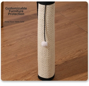 Detail of sisal cat scratching mat with plush ball wrapped around a wooden furniture leg